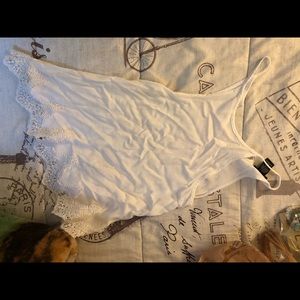 A white loose fitted top.
